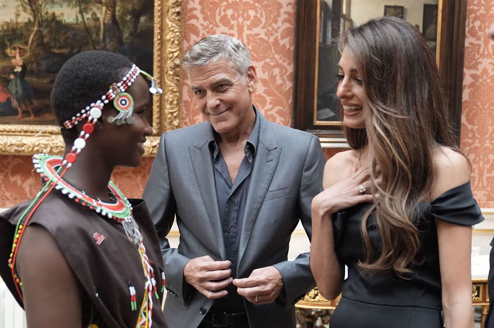 George and Amal Clooney with Alice, winner of the Amal Clooney Women’s Empowerment Award (Stefan Rousseau/PA)