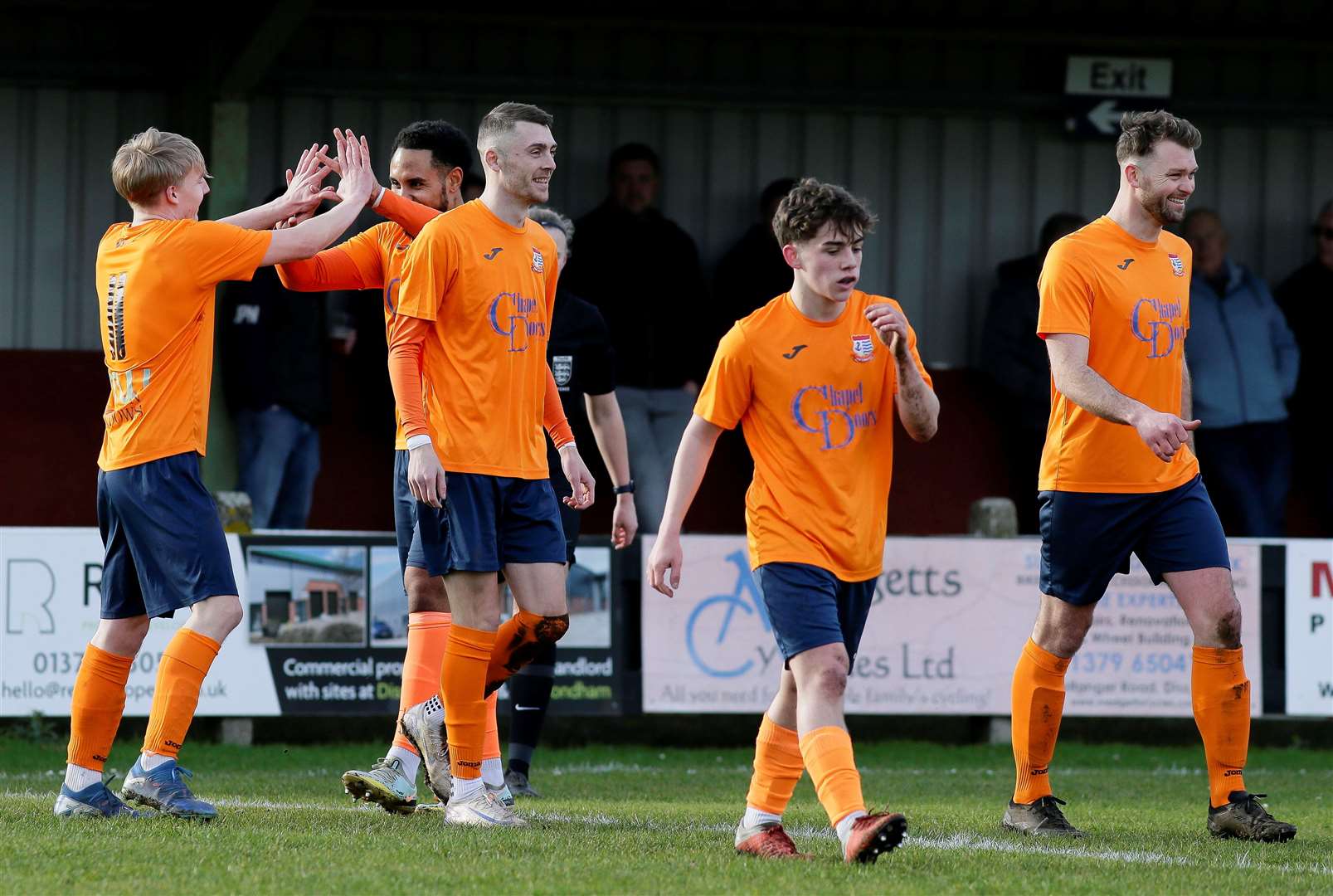 Diss players come together to celebrate Malachi Wright’s sixth-minute opener against Pinchbeck Picture: Mark Bullimore