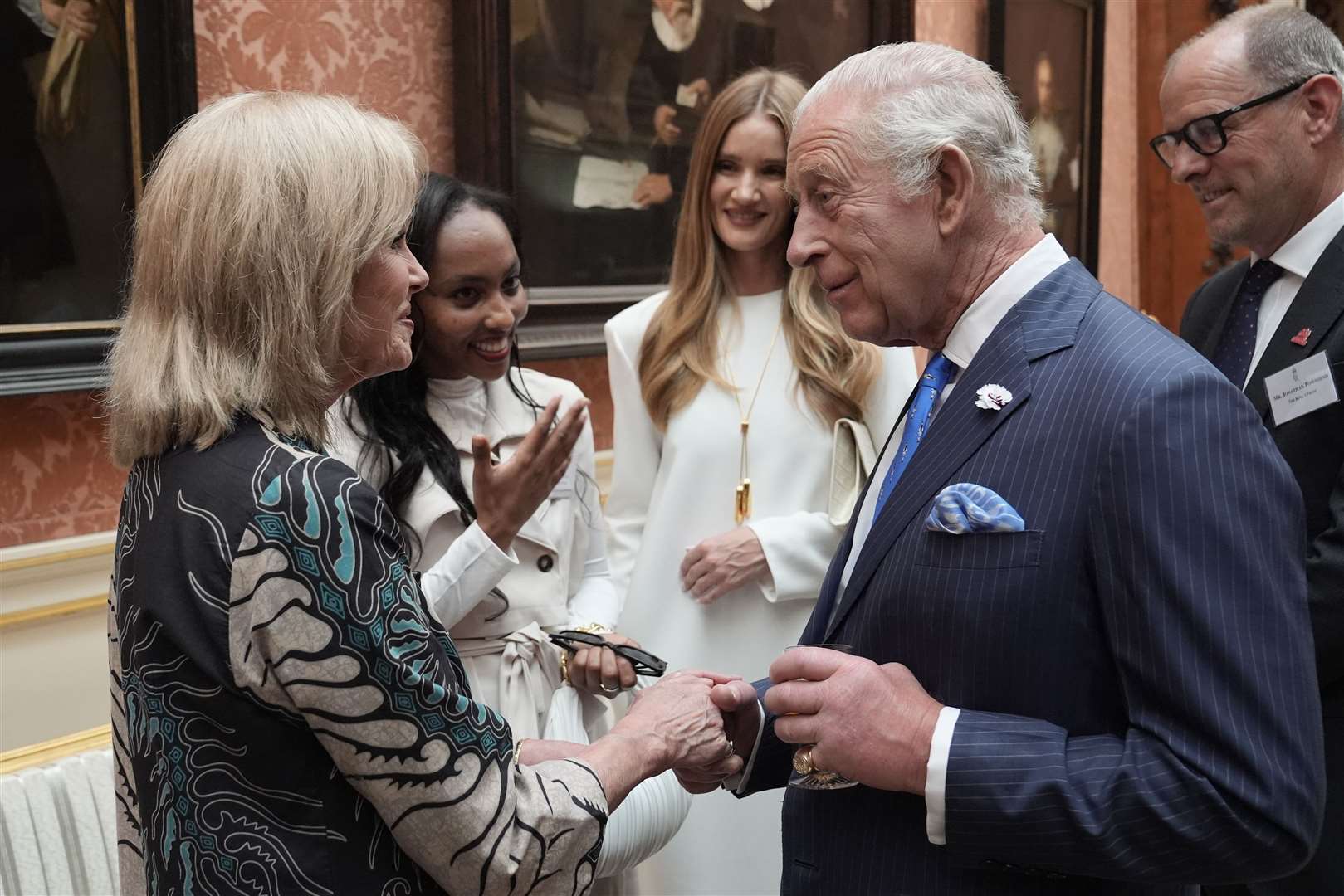 King Charles III speaks with Dame Joanna Lumley during the reception (Stefan Rousseau/PA)