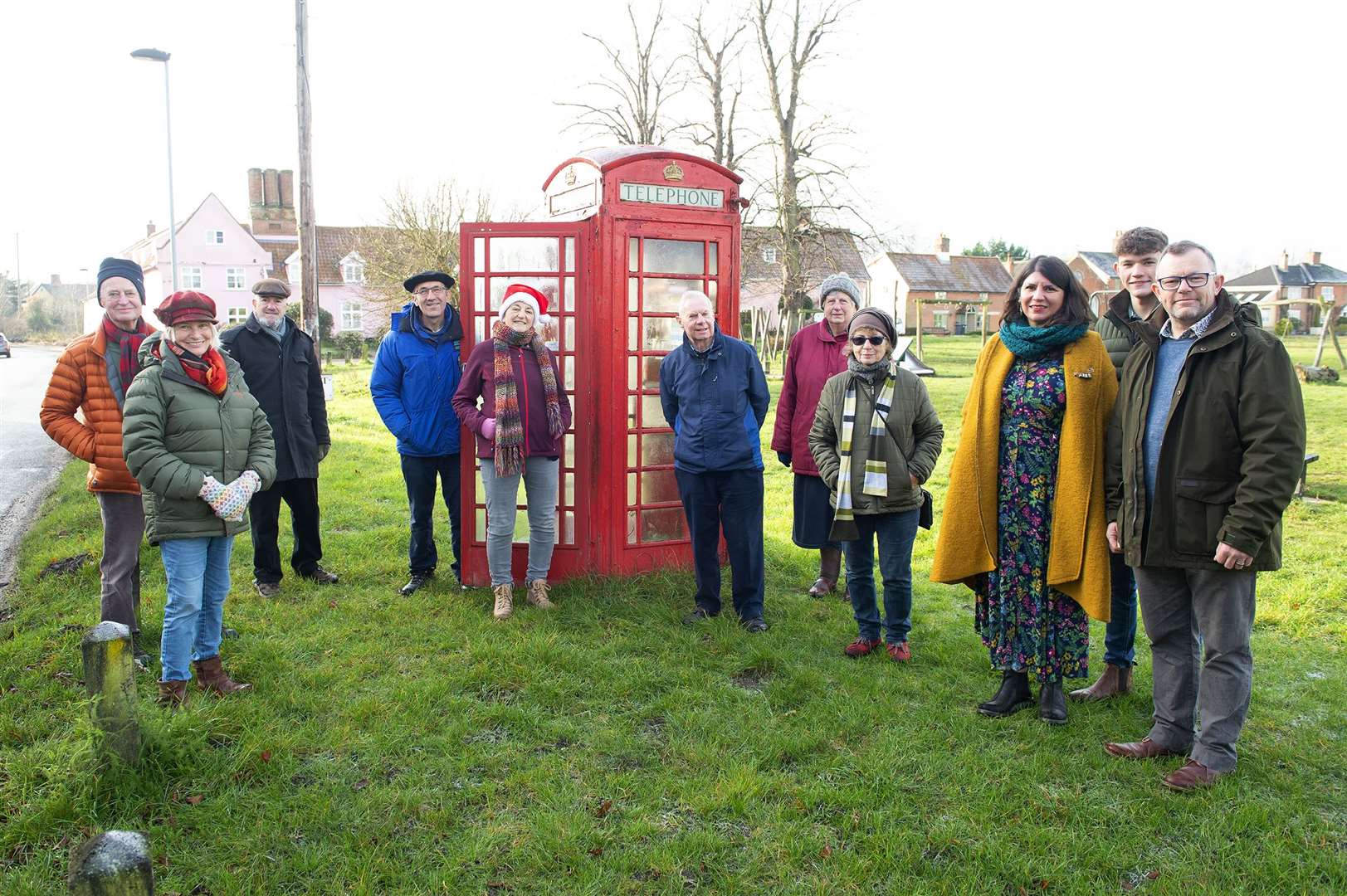 Members of the Fair Green Neighbourhood Association stood next the the post box where the defibrillator is to be installed. Pictured by Mecha Morton.