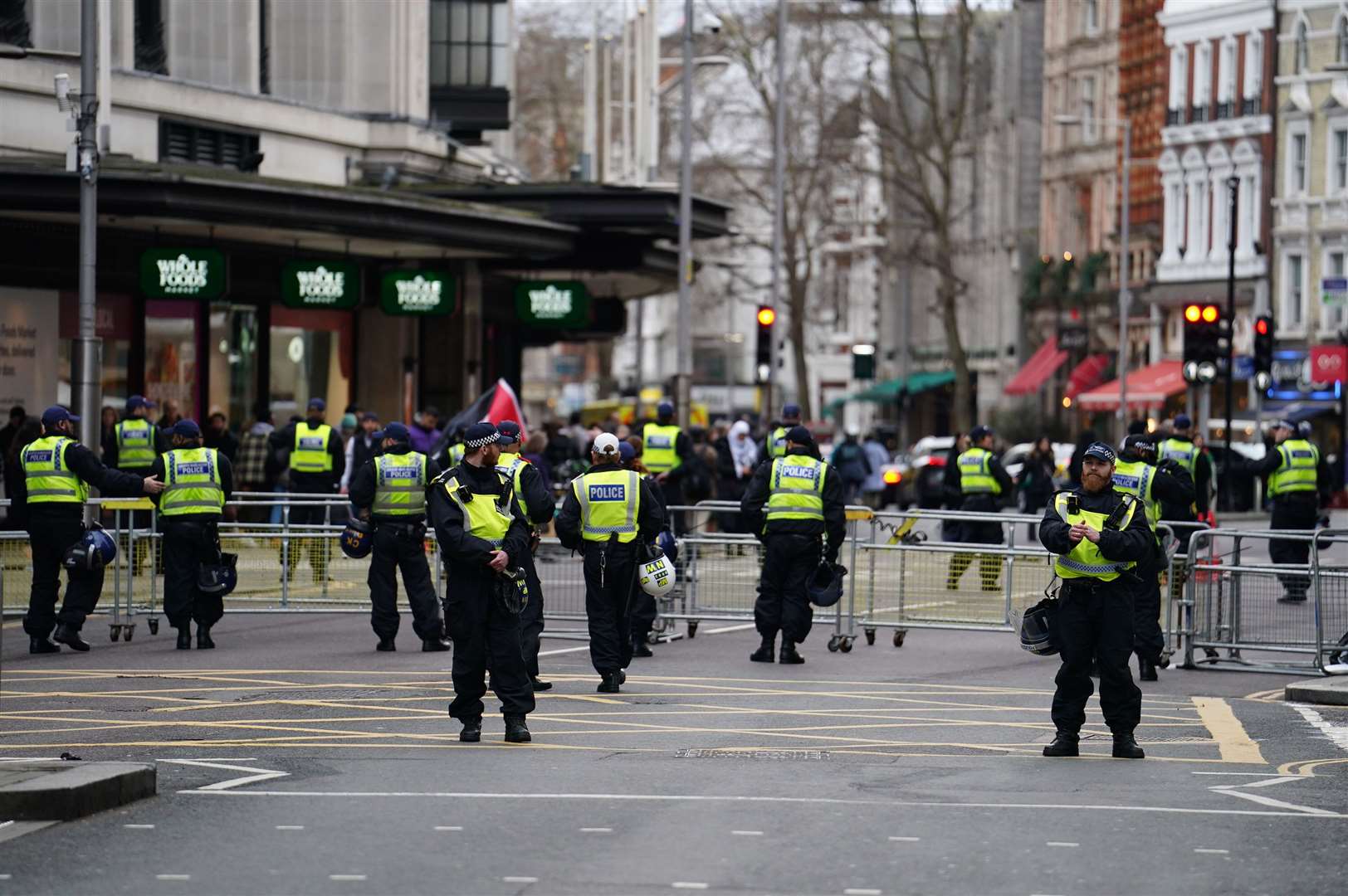 Police officers near the Israeli embassy in Kensington, London (Jordan Pettitt/PA)