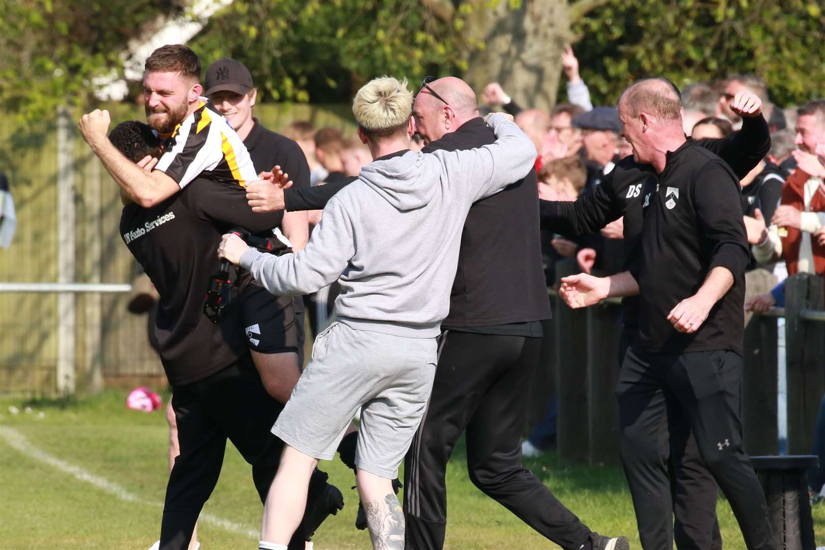 The Harleston bench celebrate after the final whistle against Downham. Picture: Gary Donnison