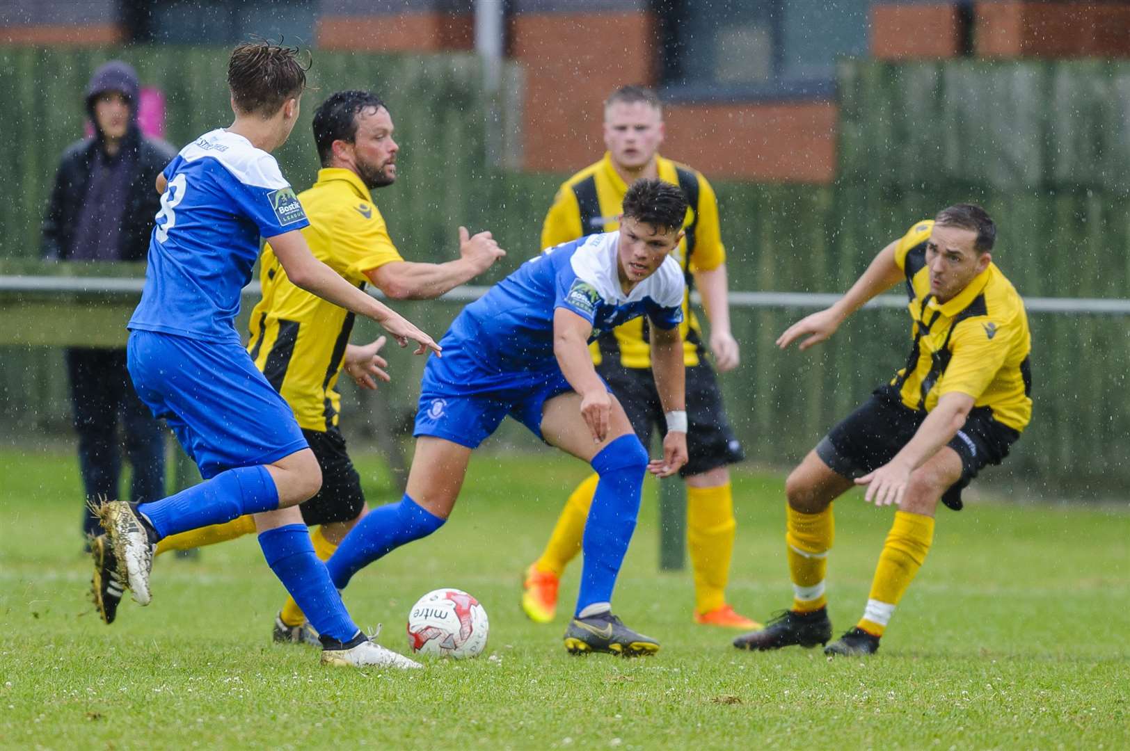 Football action from Debenham LC v Bury Town..Debenham players LEFT TO RIGHT – KEVIN BARKER, MAX HUTCHINGS, MICHAEL VELZIAN..Picture: Mark Bullimore Photography. (13683638)