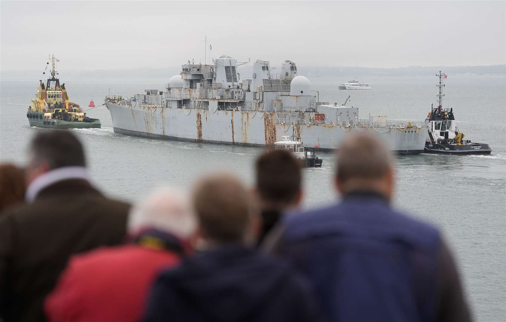 HMS Bristol was towed out of Portsmouth harbour on Wednesday to begin its journey to Turkey to be recycled (Andrew Matthews/PA)