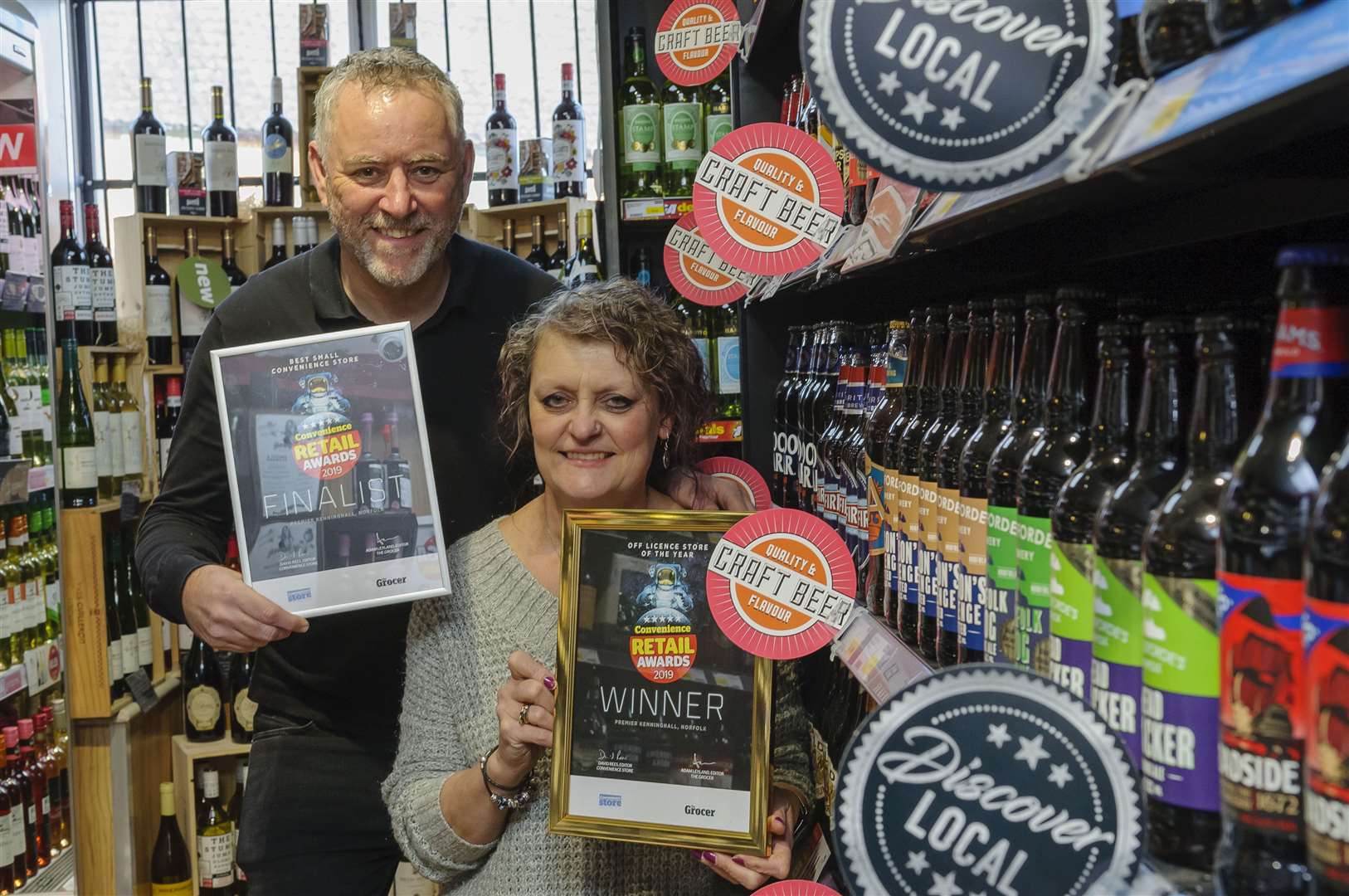Mike and Karen Humphreys show off their award for best off-licence of the year. Picture by Mark Bullimore.