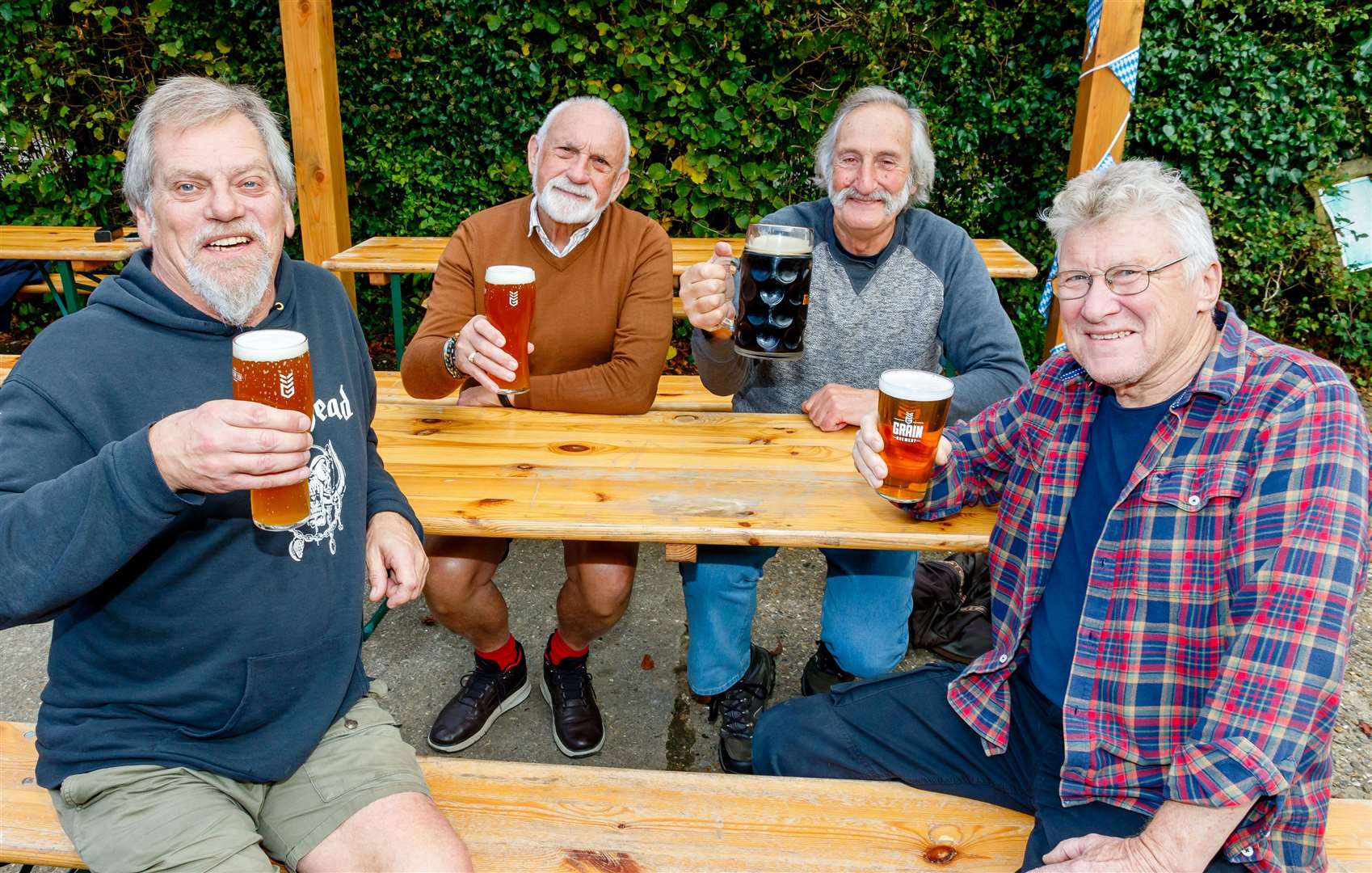 Friends Ian McPherson, Martyn Lane, Jack Bloomfield and Bob Turner enjoy a drink (of varying sizes).