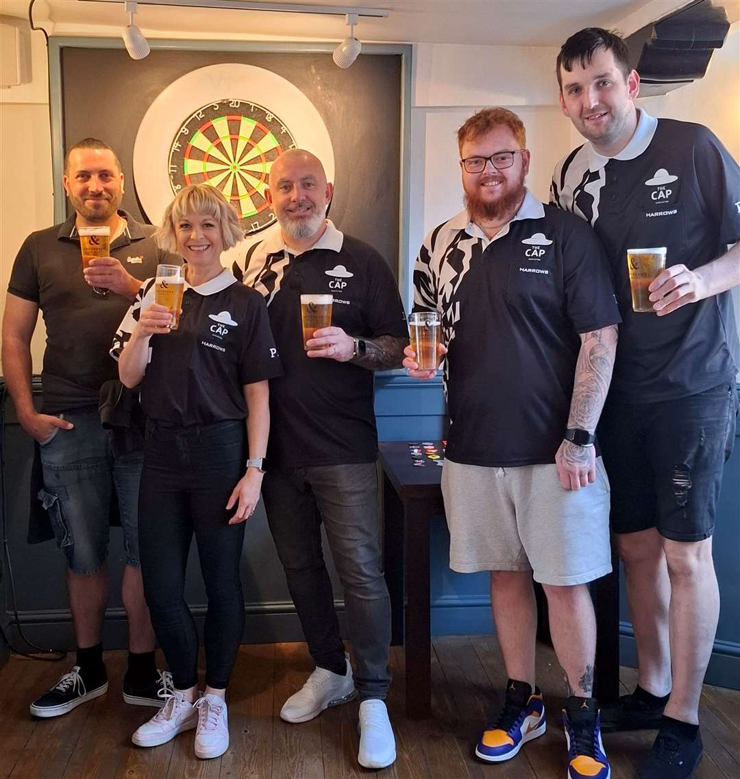 Justin Harper, Vicki Hirst, Matt Hirst, Sean English and Matt Leonard. Members of The Cap darts team having the first pints of their own brewed beer "180" moments before the 12 hour challenge began.