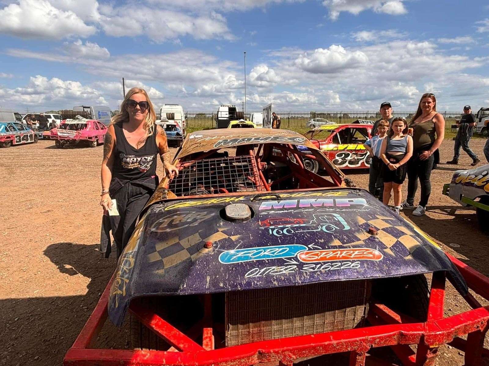 Marie Mayes at the track with the stock car she used on the day. Picture submitted