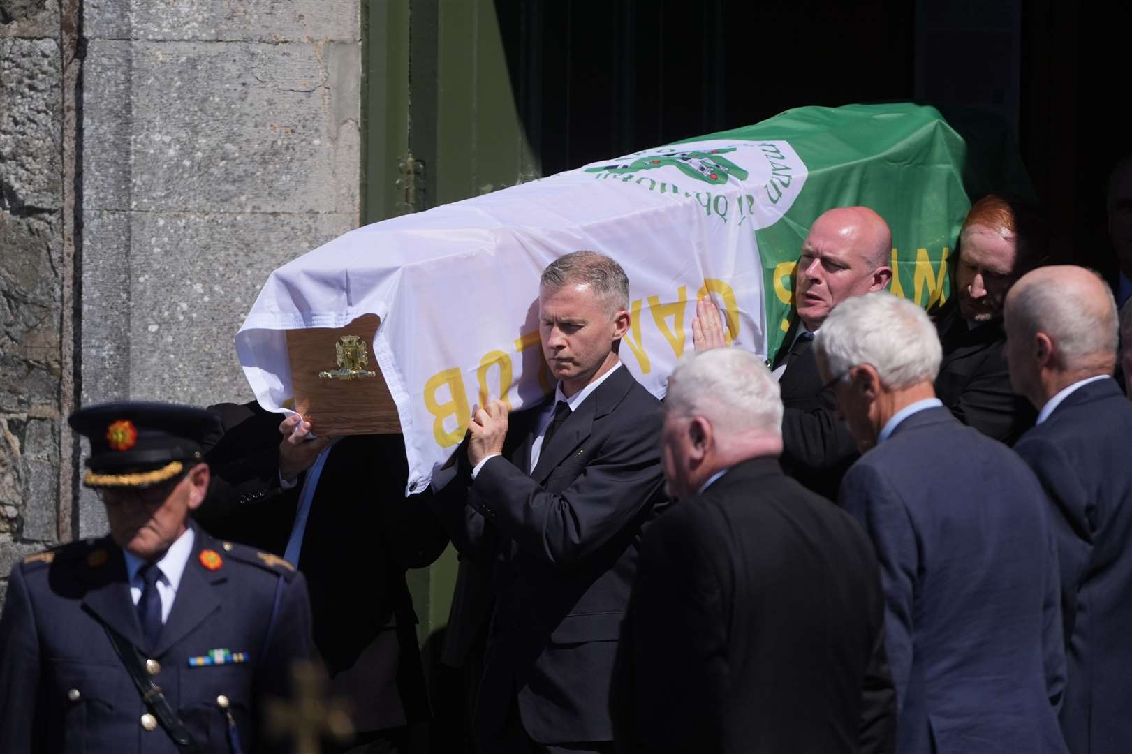 The coffin of Garda Kevin Flatley is carried from St Peter and Paul’s Church in Balbriggan, Co. Dublin (Brian Lawless/PA)