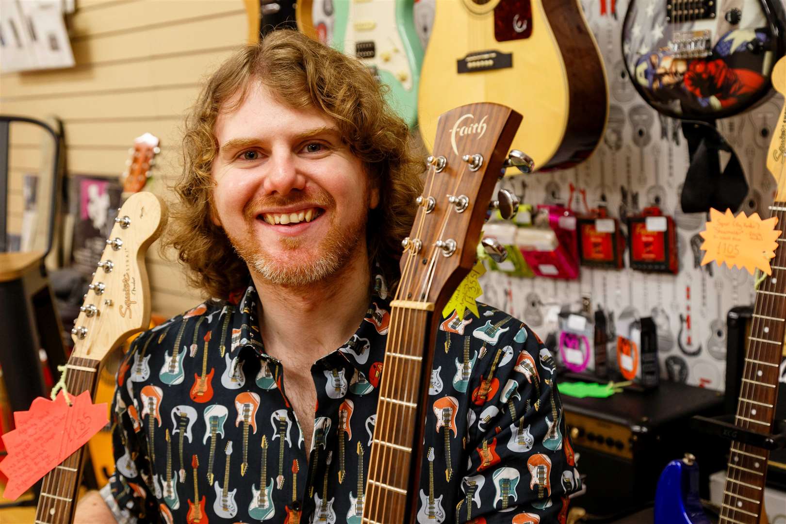 Ready and waiting: James Ready with some of the guitars he is selling. Picture: Mark Bullimore