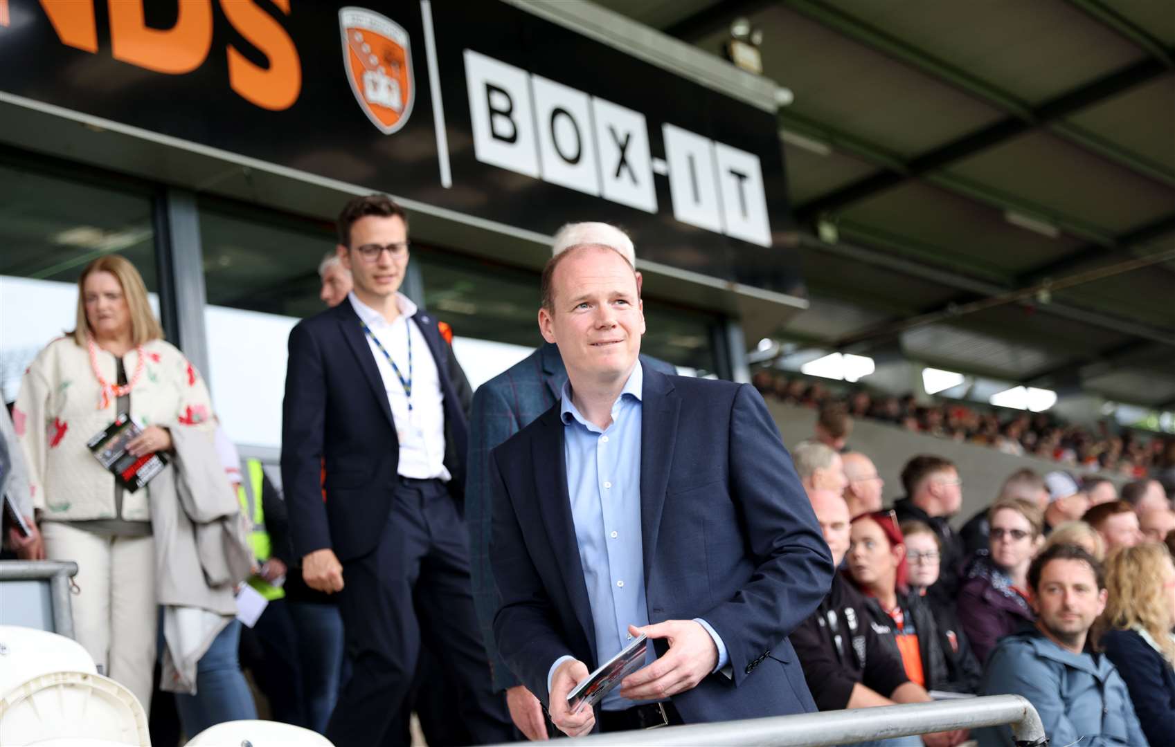 DUP sports minister Gordon Lyons takes his seat at his first GAA match, the Armagh vs Derry Senior Football Championship, at the Athletic Ground in Armagh on Saturday (Peter Morrison/PA)