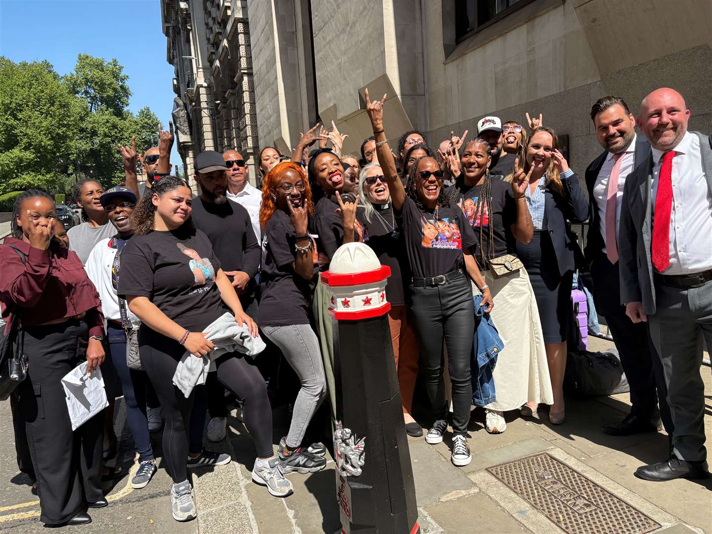 The family of Cher Maximen and supporters outside the Old Bailey in central London (Emily Pennink/PA)