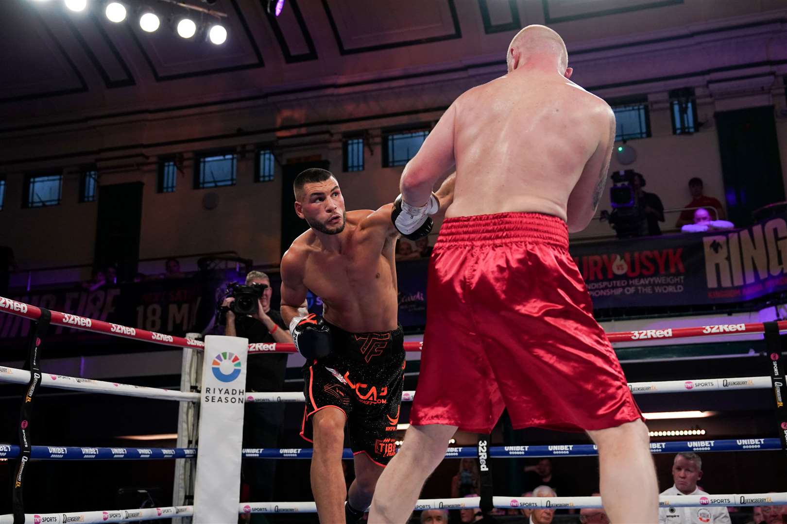 Tommy Fletcher swings a left arm at Viktar Chvarkou. Picture: Queensberry Promotions