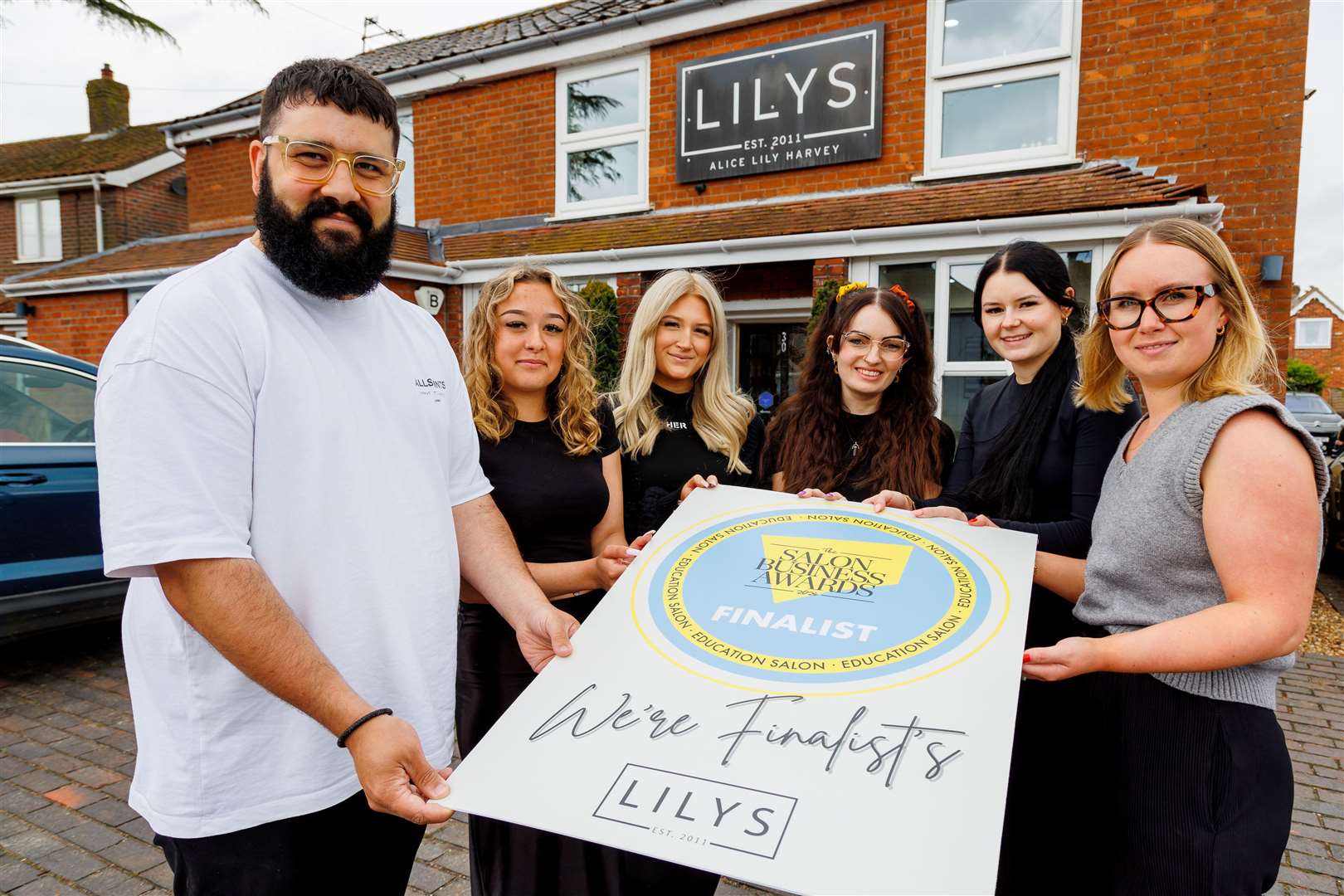 Callum and Alice Harvey with members of staff of Lilys in Diss. Picture: Mark Bullimore