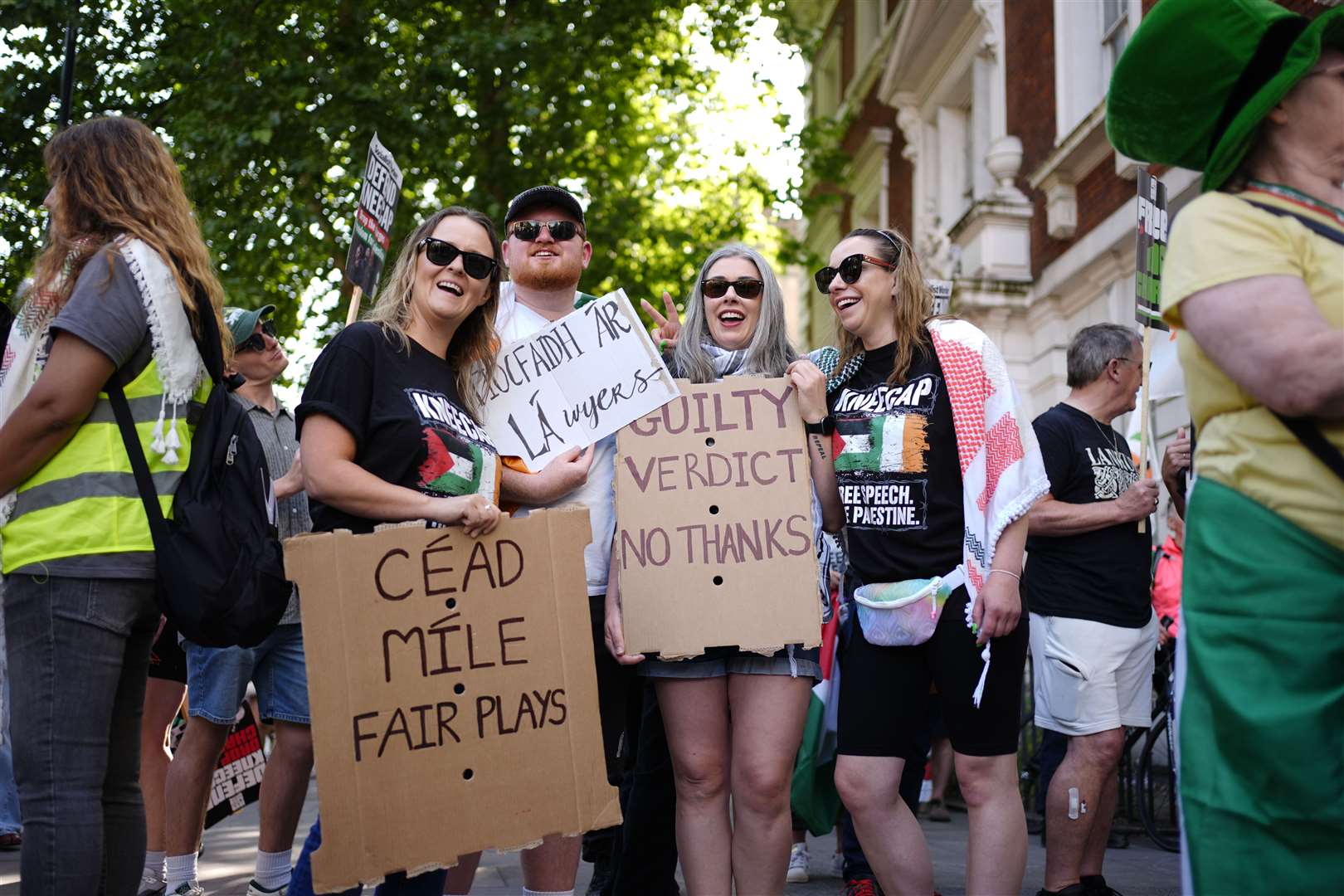 People with placards in support of Kneecap’s Liam Og O Hannaidh outside Westminster Magistrates’ Court (Jordan Pettitt/PA)