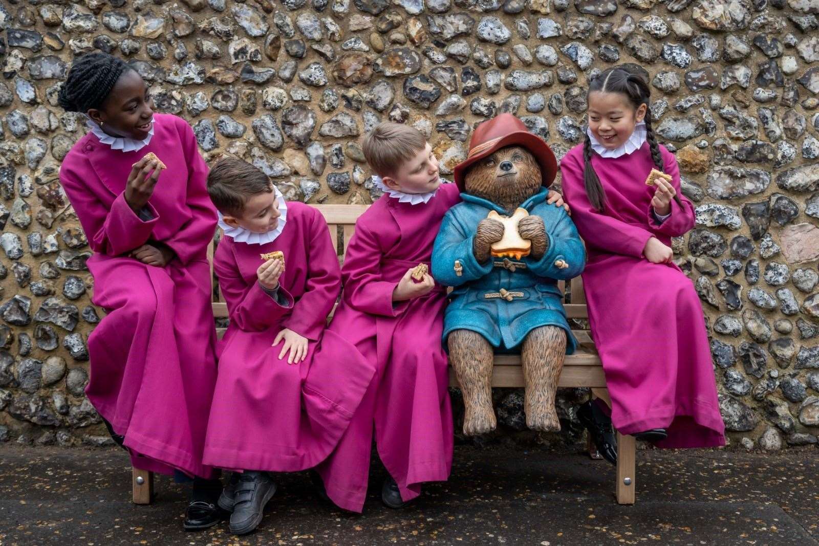 Norwich choristers meeting the new Paddington statue. Picture: STUDIOCANAL