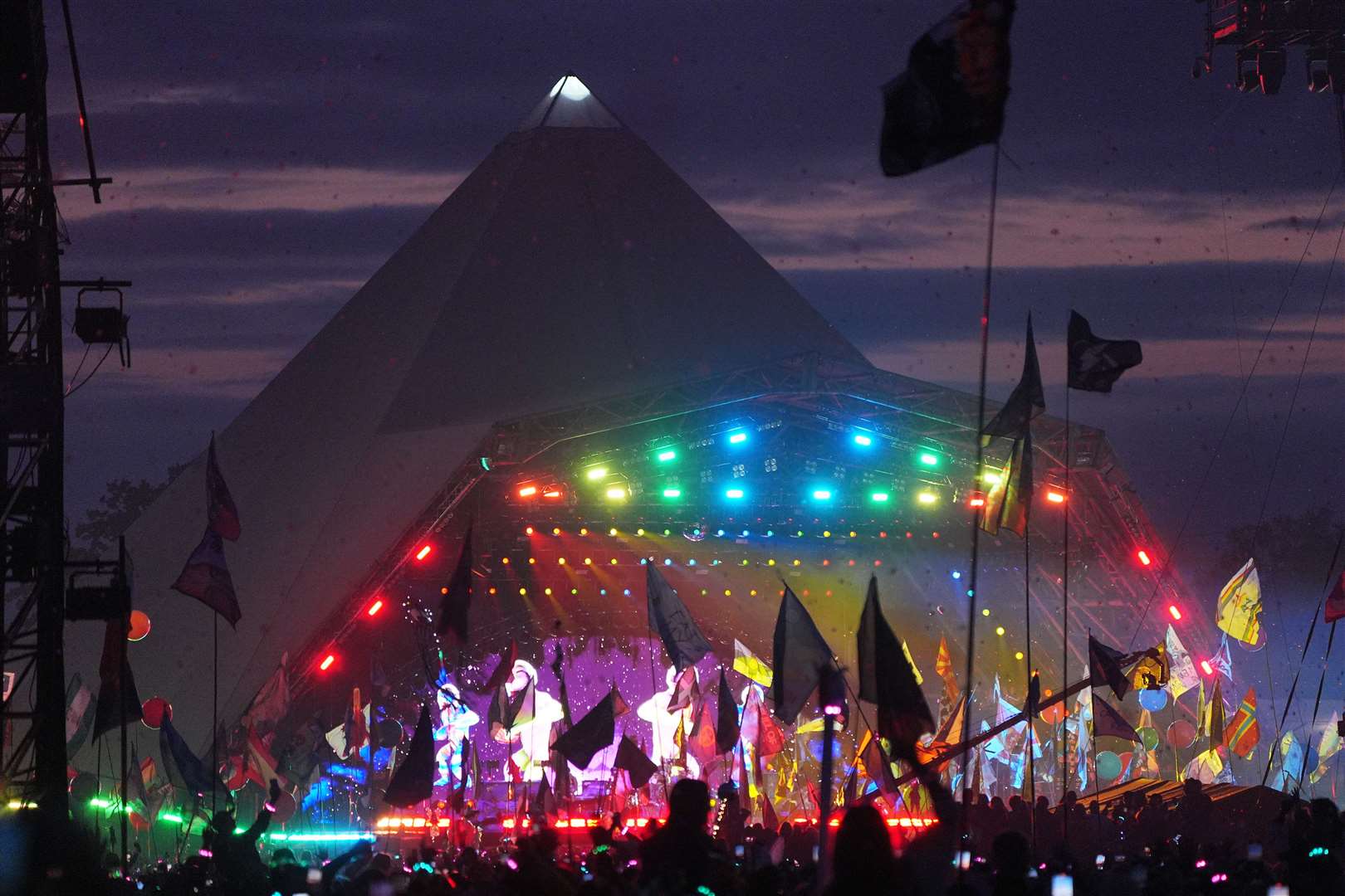The crowd watching Coldplay performing on the Pyramid Stage at the Glastonbury Festival, Worthy Farm (Yui Mok/PA)