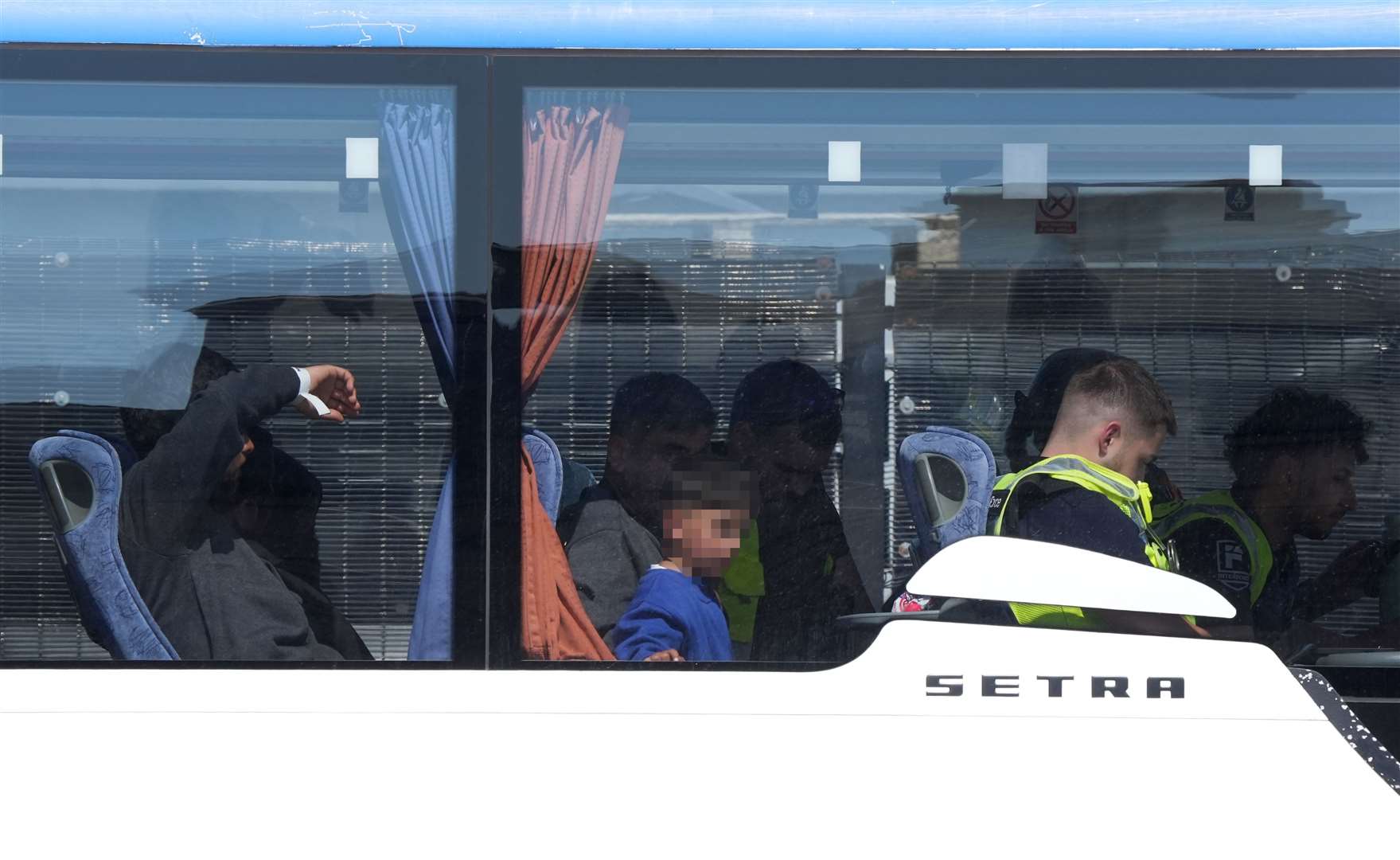 People believed to be migrants leaving by bus in Dover, Kent, following small boat crossings in the Channel (Gareth Fuller/PA)