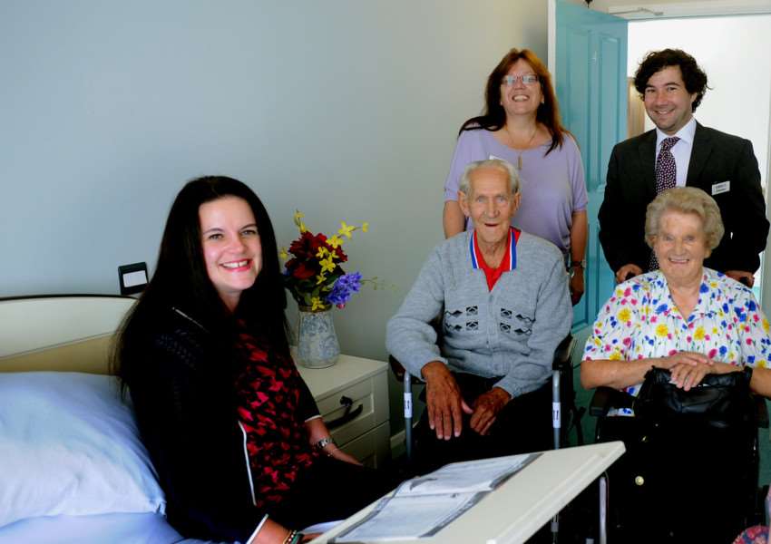 (L-R) Councillor Beccy Hopfensperger, Suffolk County Council cabinet member for adult care, takes a look at one of the new bedrooms at Hartismere Place, with Paddock House residents Alfie Elliott and Eva Fish and (standing) Hartismere Place home manager Cathryn Weed and Care UK regional director Phillip Steyn. ANL-151008-163057001