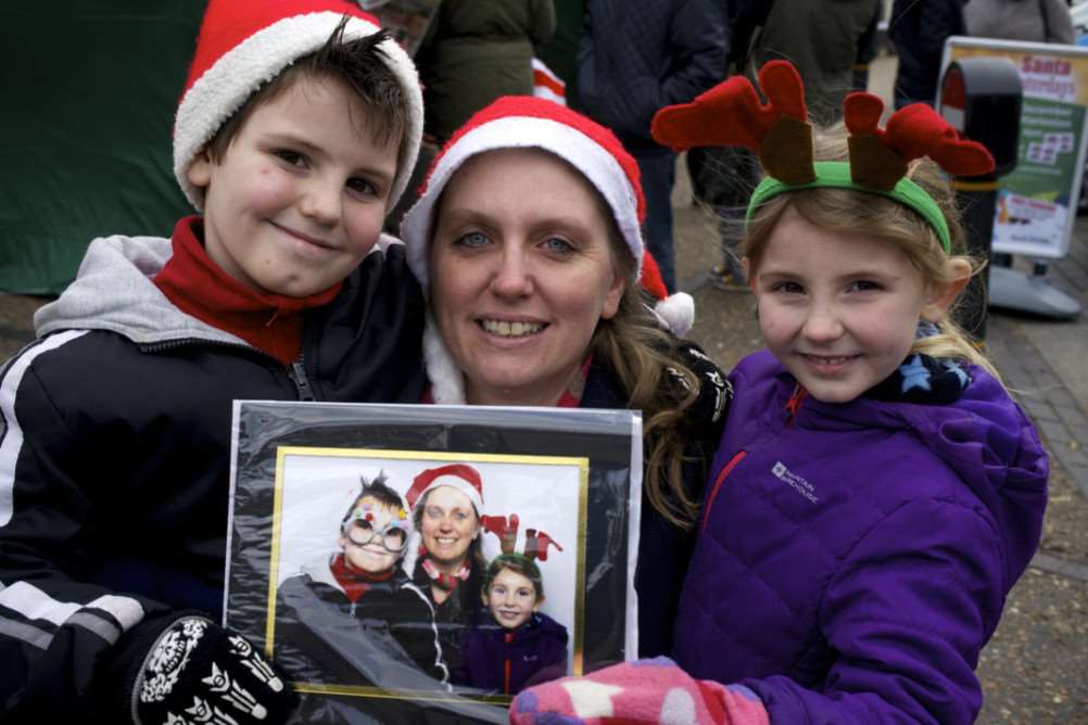 Diss, Norfolk. Diss Town Centre Walkabout performers and Christmas photo booth in the market place pictured is Joe Chapple, Sam Johnson and Kerensa Chapple ANL-141220-212240009