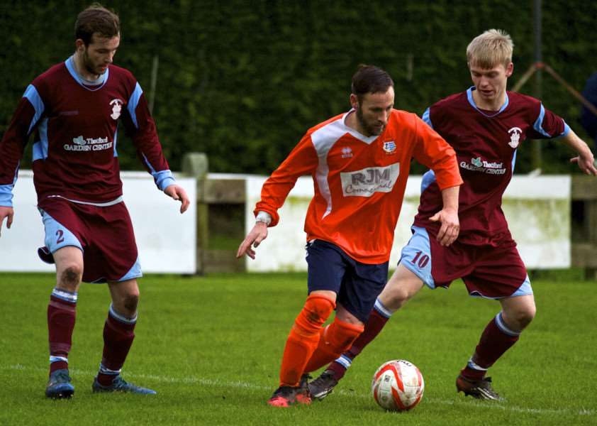 ON THE MOVE: Striker Matt Dixon (centre) will not be re-signing for Diss Town after opting to join league rivals Stowmarket Town this week