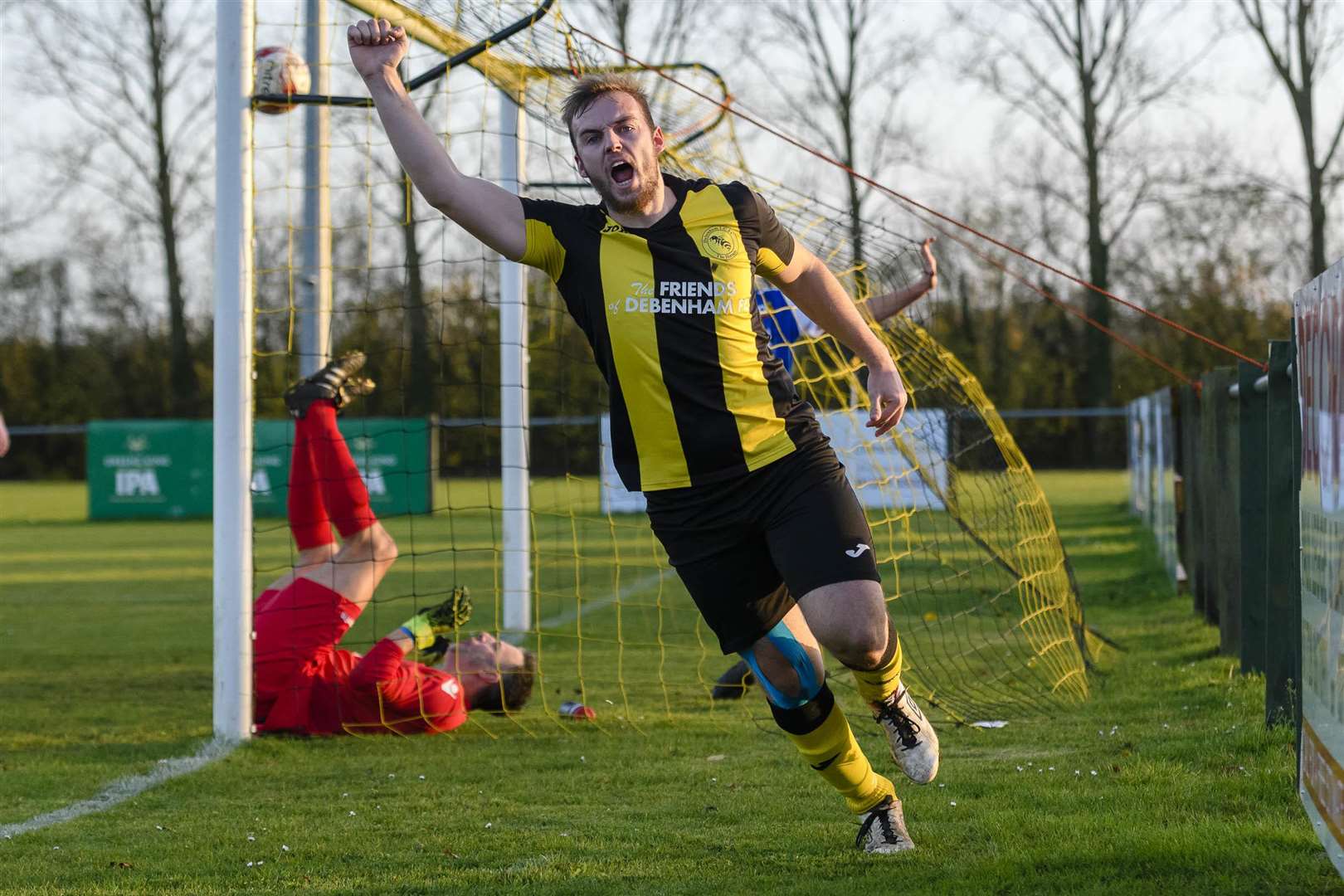 Football action from Debenham LC vs Cornard - Bradley Austin (D) scores a goal against Colin Athey (C)...Picture: Mark Bullimore Photography. (5328620)
