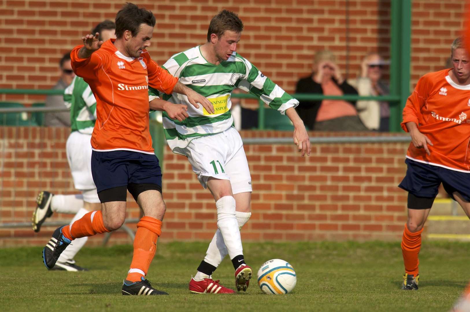 Framlingham, Suffolk. Football action from Framlingham Town FC vs Diss Town FC in the FA Vase - Liam Abrahams (F) and. (2414865)