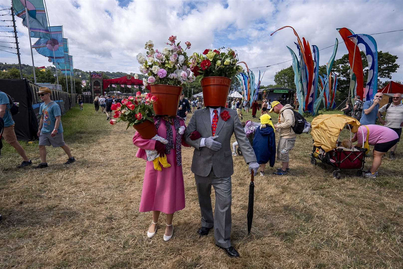 People dressed as flowerpots were one of the sights at the festival on Thursday (Ben Birchall/PA)