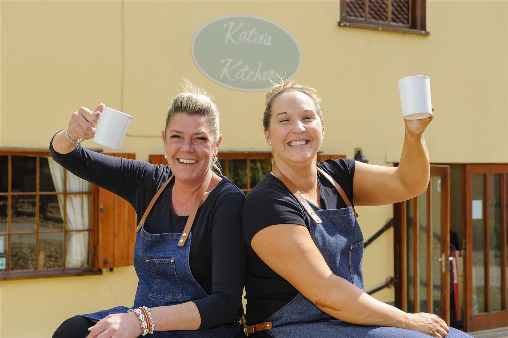 Diss, Norfolk. Katie Rich (left) owner of Katie's Kitchen in Hales Yard has sold it to Katie Devereux (right)..Picture: Mark Bullimore. (2313349)