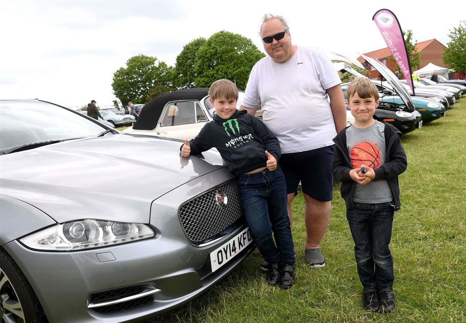 William, 10, Max, six, with dad Steve Sadler and his Jaguar XJ 2014. Picture: Mecha Morton