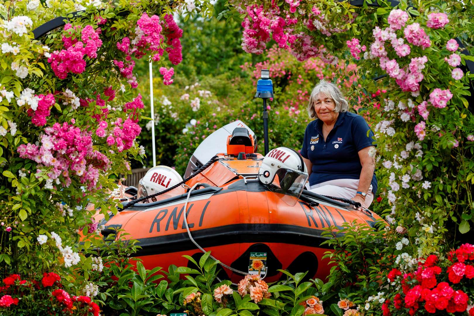 Sue Lord, chairman of Dereham and District RNLI Branch, with Peter Beales’ display for the charity. Picture: Mark Bullimore