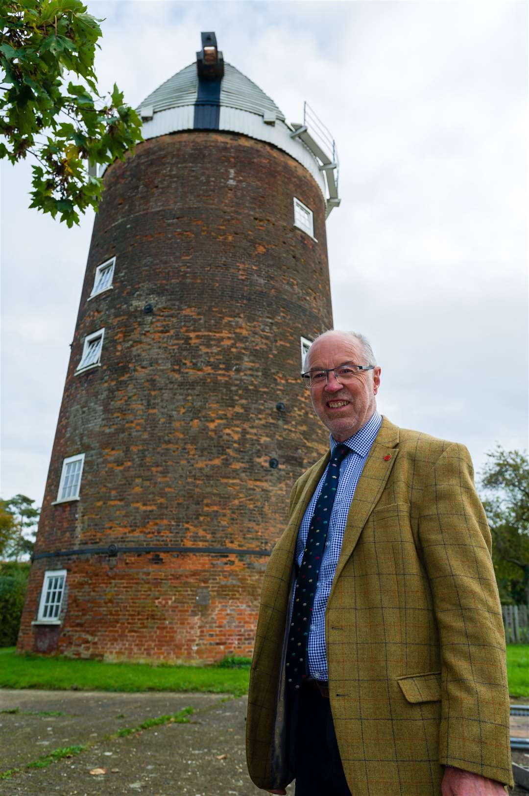 Old Buckenham, Norfolk, 10/10/2020..Chairman of the Norfolk Windmills Trust Martin Wilby in front Old Buckenham Windmill which has been given Â£120,000 in grants so it can have brickwork repaired and then can be reopened to the public for tours...Picture: Mark Bullimore Photography.
