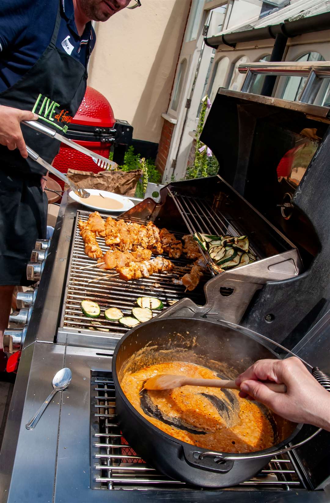 The peanut sauce simmers on the gas BBQ for the Thai chicken skewers at the Live Al Fresco BBQ cooking course Picture: Wendy Aiken Photography
