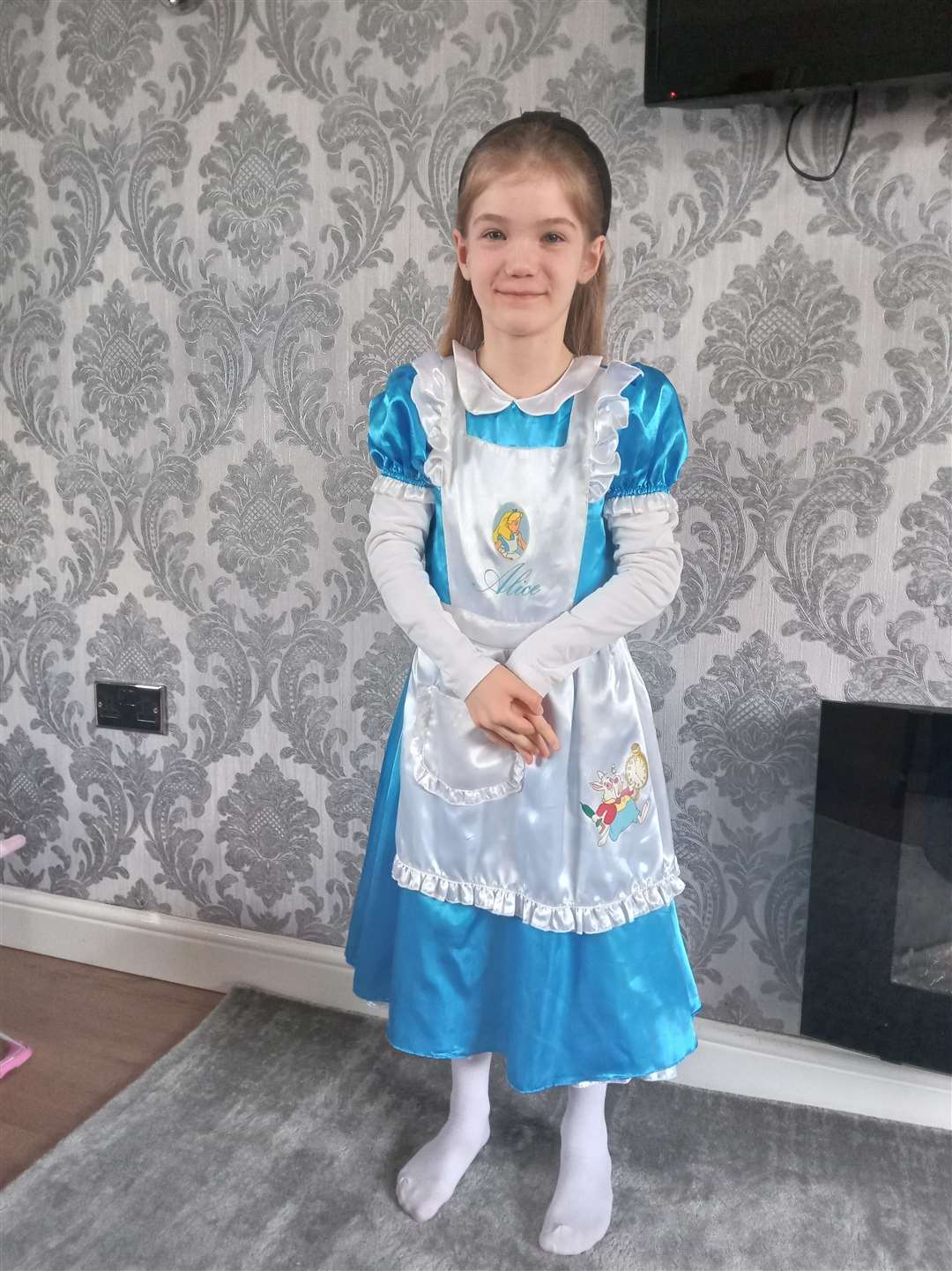 Seven-year-old Rumer, dressed as Alice from Alice in Wonderland.