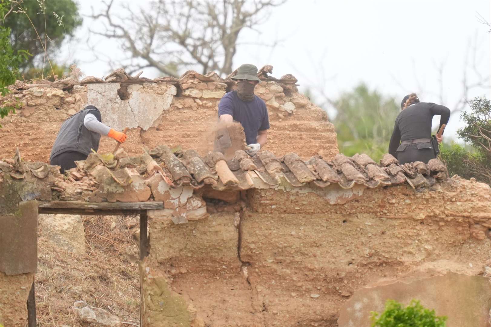 Teams dug, shifted rocks and cleared scrub as the work continued on Tuesday (James Manning/PA)