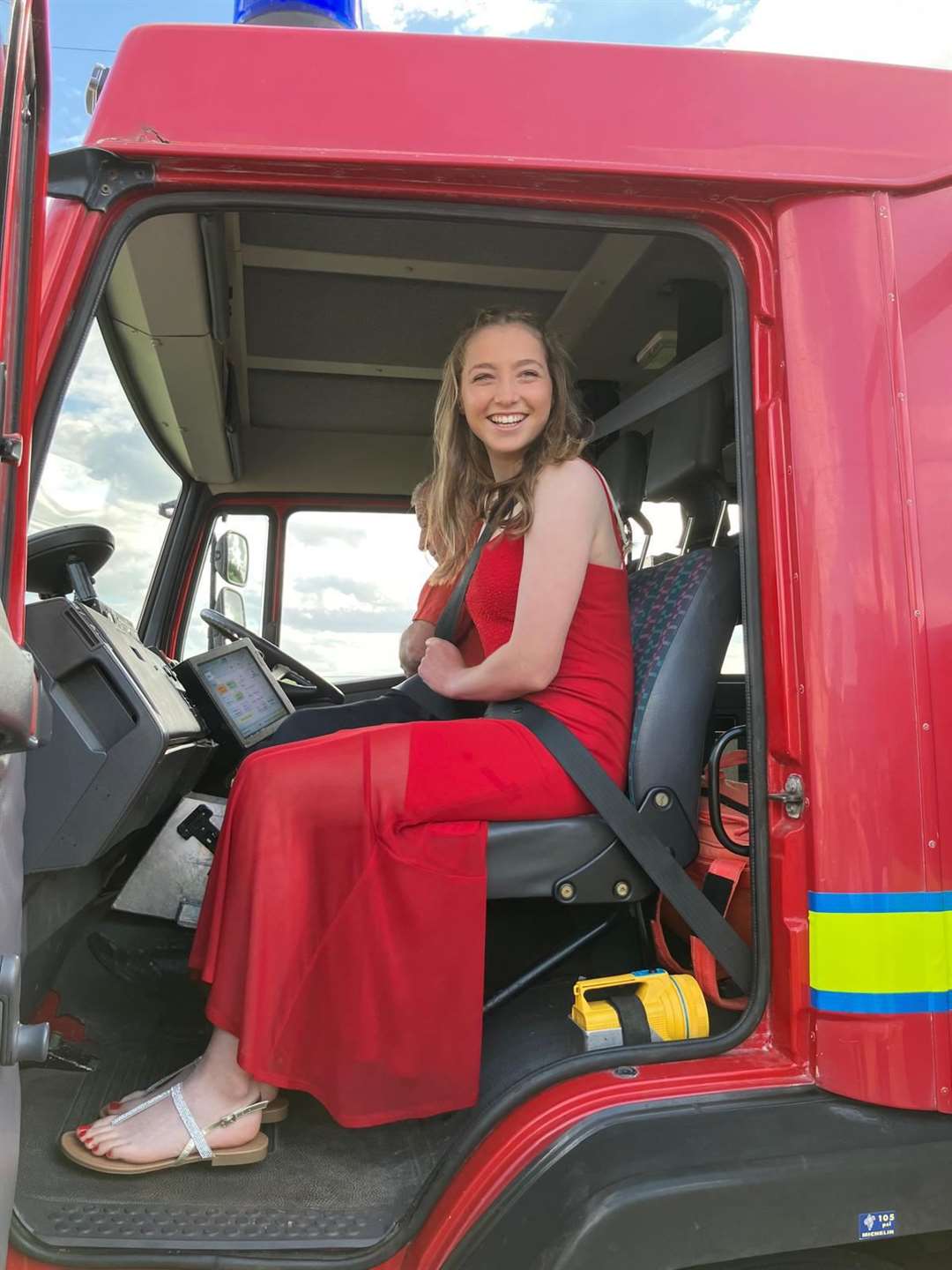 Holly was all smiles as she took her seat in the fire engine. Picture submitted