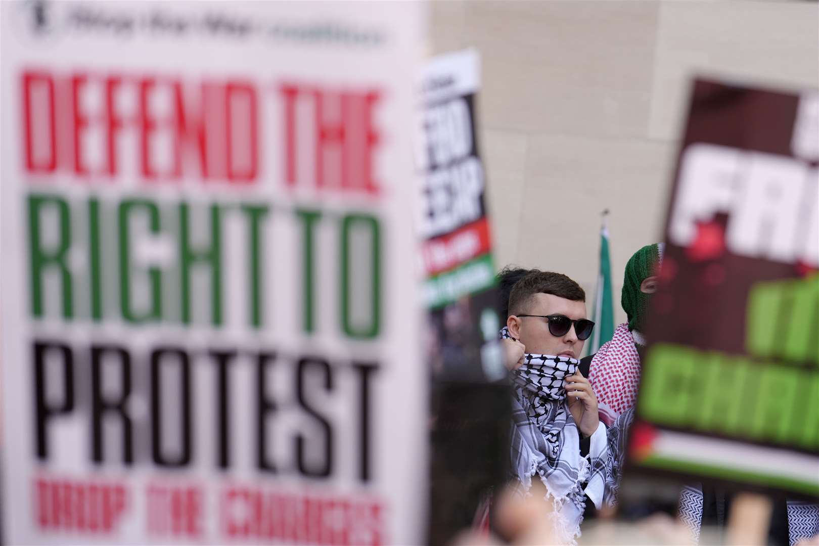 Kneecap’s Liam Og O Hannaidh leaving Westminster Magistrates’ Court in London, through a crowd of supporters (Jordan Pettitt/PA)