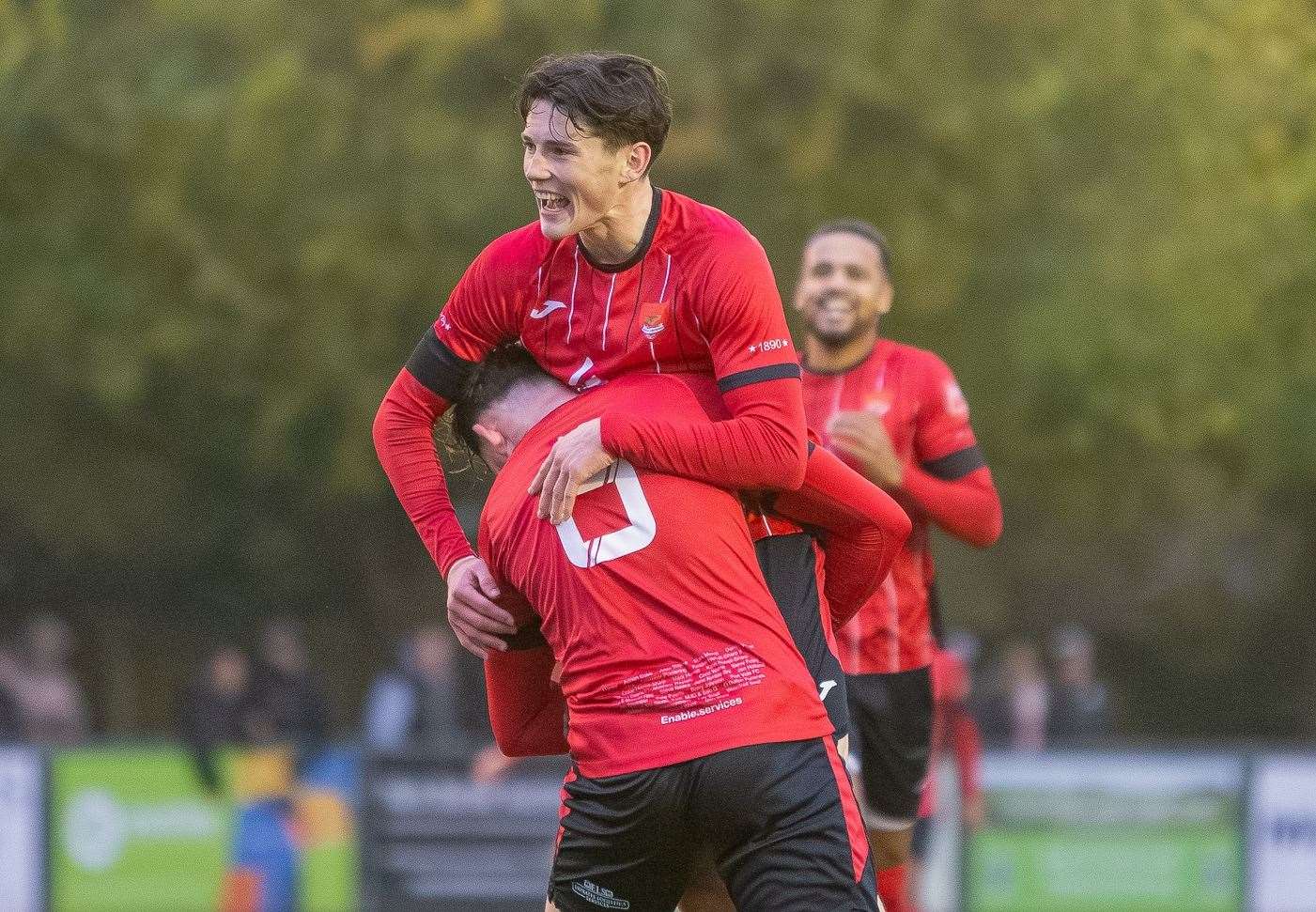 Charlie Warren is lifted up after scoring the second goal for Felixstowe & Walton United against Cambridge City at the Martello Ground Picture: Stefan Peck