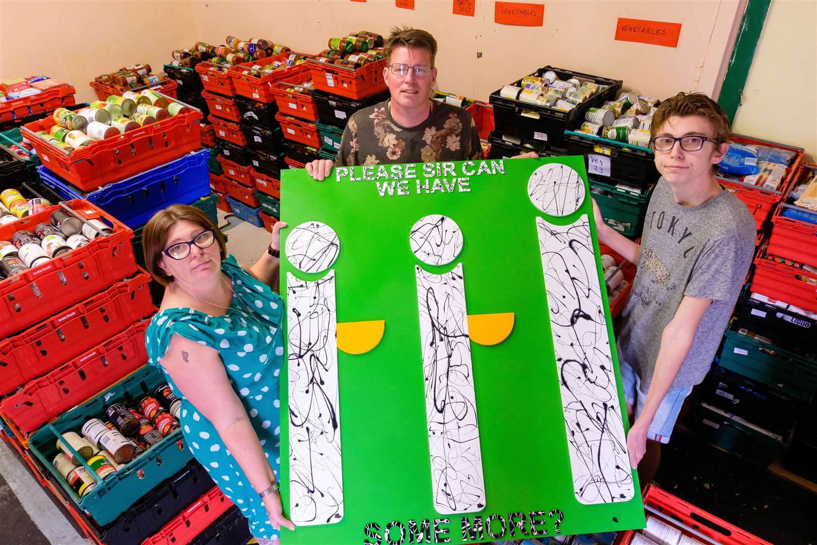 Michala, Matthew and Tony Scade with the donated piece of artwork.Picture: Mark Bullimore