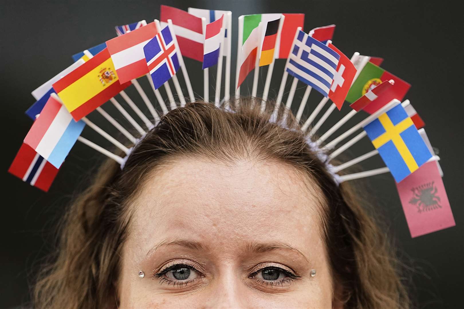 A Eurovision fan turns heads in the queue (Martin Meissner/AP)