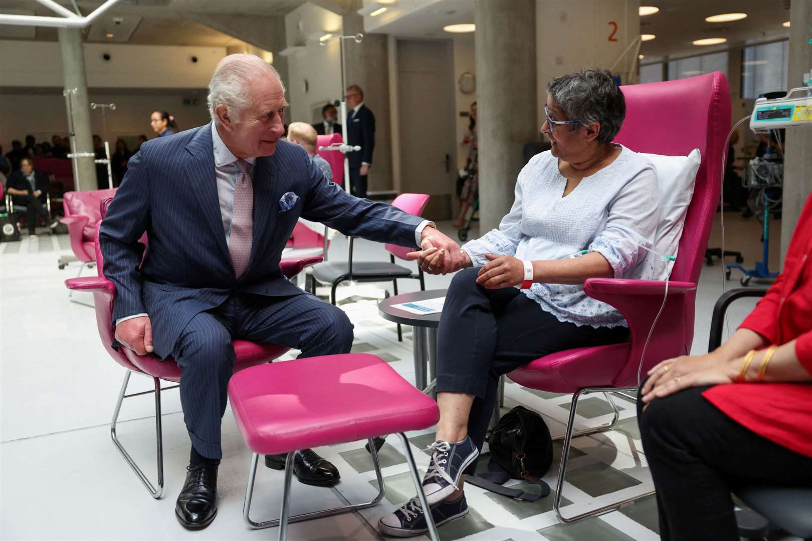 The King, patron of Cancer Research UK and Macmillan Cancer Support, meets patient Asha Millan at the University College Hospital Macmillan Cancer Centre last year (Suzanne Plunkett/PA)