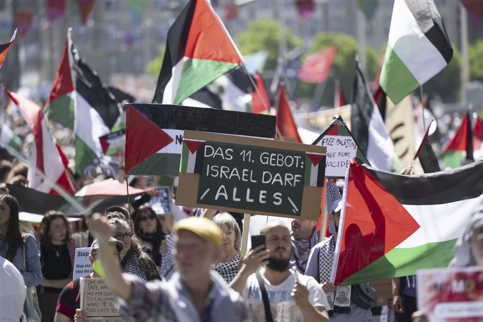 Pro Palestinian protesters during the opening ceremony of the 69th Eurovision Song Contest (Georgios Kefalas/Keystone via AP)