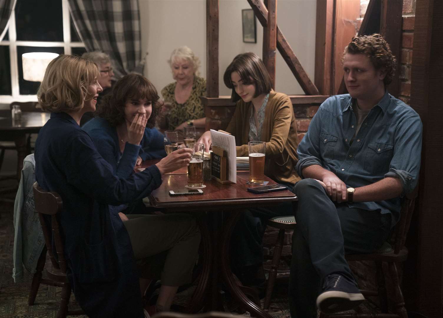 Iris Houseago, rear left, had to act preoccupied and uninterested as youngsters, including Lily James, got excited as lead actor, Hamish Patel, played Yesterday on his guitar. Jonathan Prime/Universal Pictures