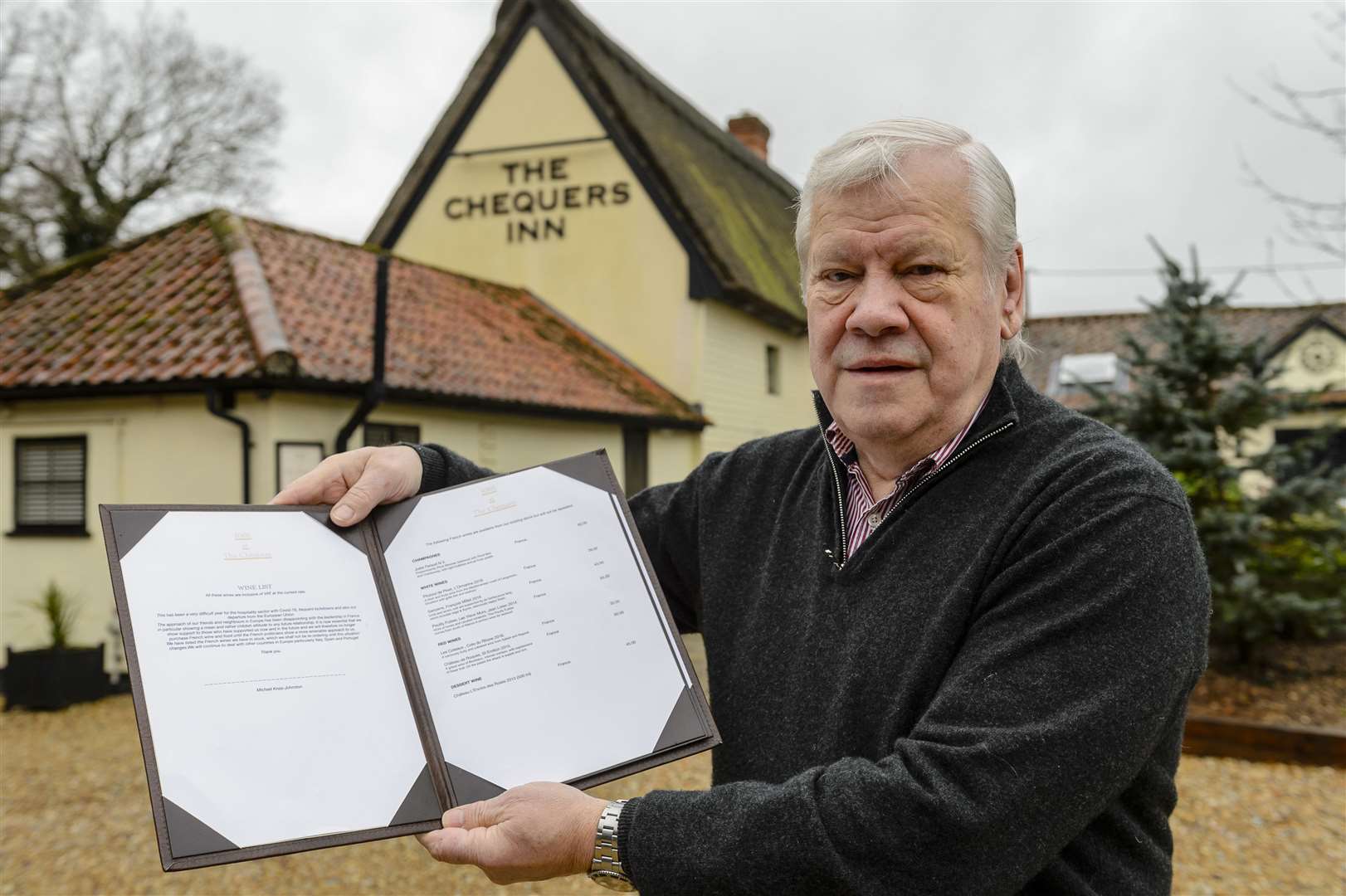 Michael Knox-Johnson with his wine list, which includes a message explaining his decision to stop serving French food and wine. Picture: Mark Bullimore Photography 2022.