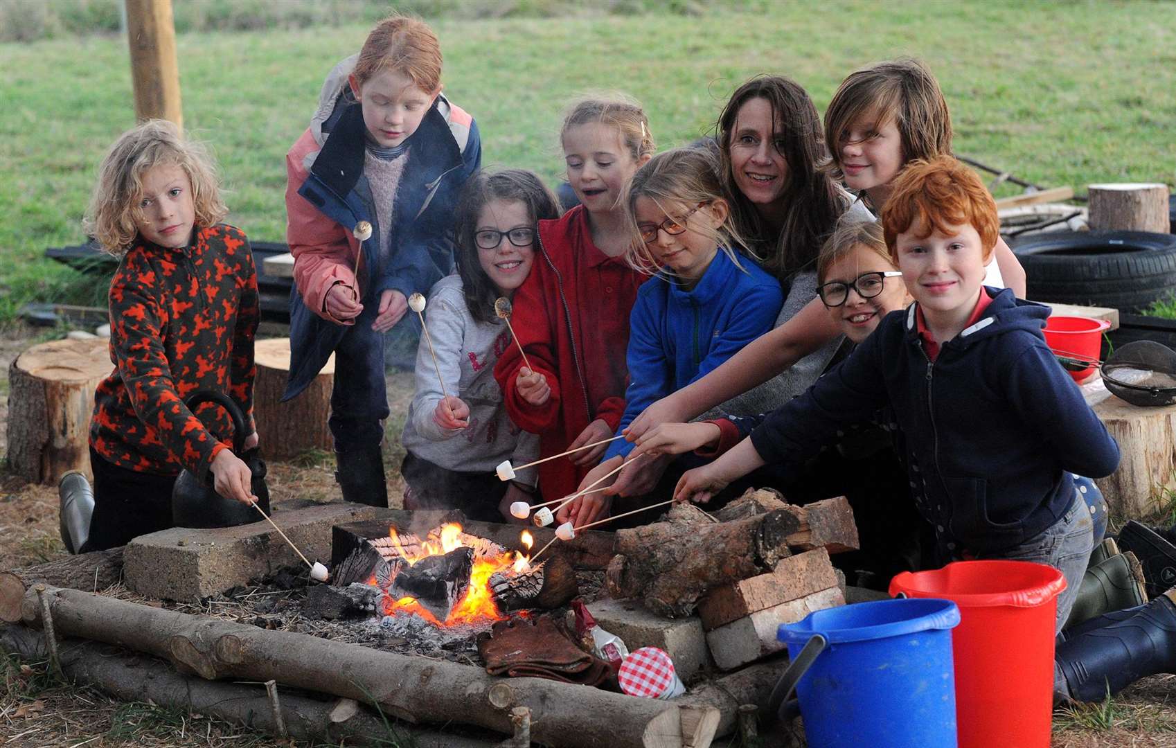 FIRED UP: Children toast marshmallows over a fire. Picture by Mecha Morton.