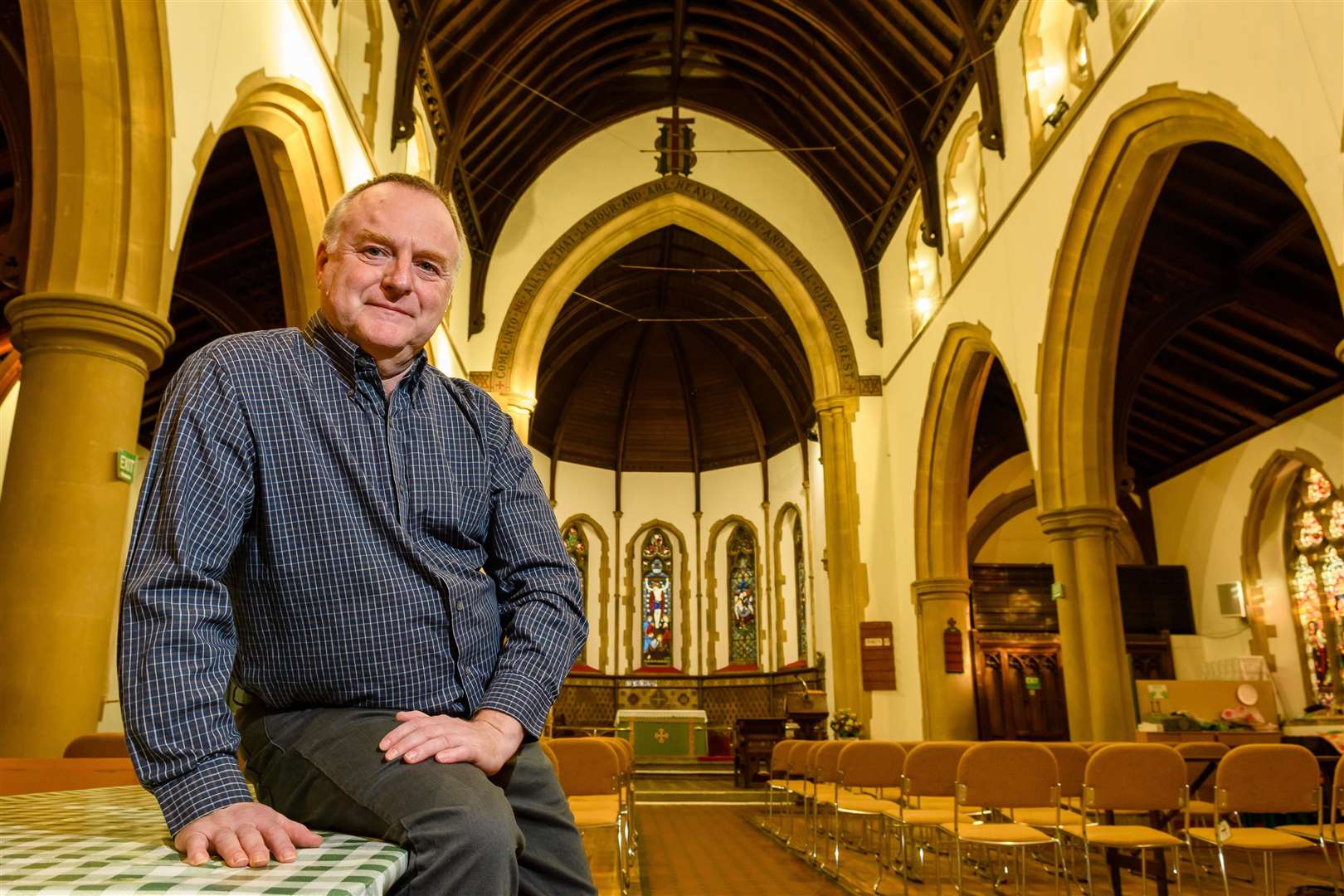 Trevor Graham, pictured here at St John's Church in Harleston, has warned that public services could be strained if plans for a new development in the town are approved. Mark Bullimore Photography.