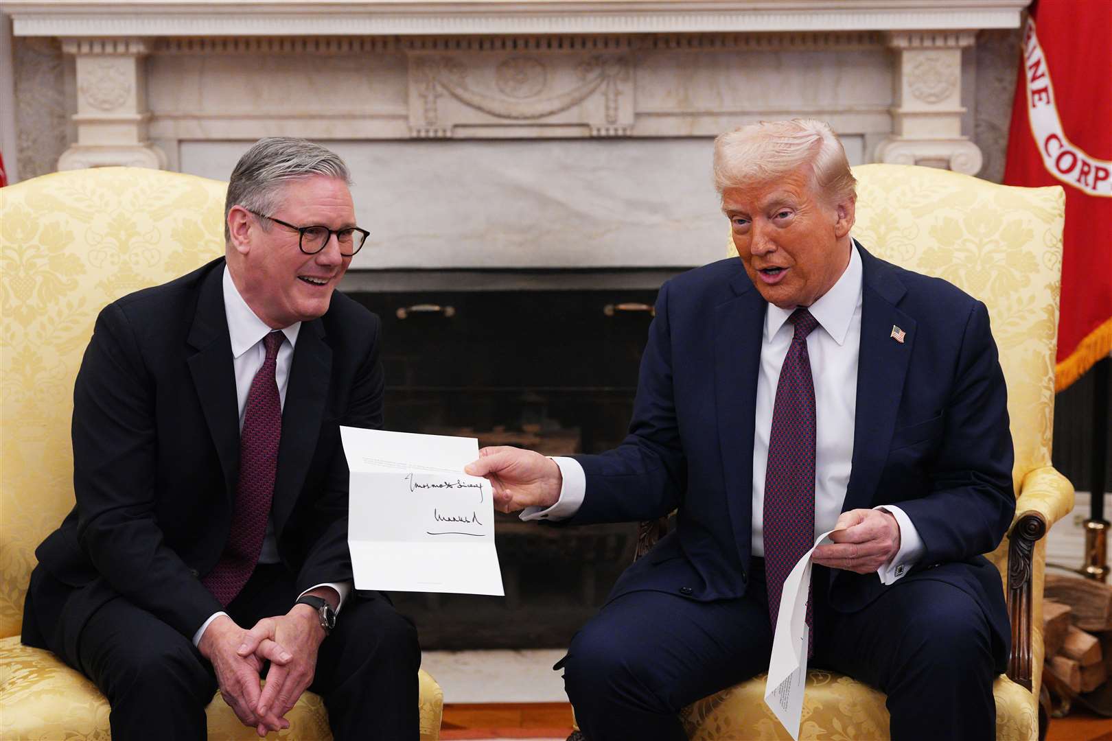 US President Donald Trump is presented with a letter from the King in February suggesting a first meeting and then a state visit (Carl Court/PA)
