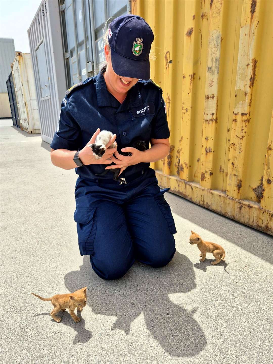 Petty Officer Kirsty Scott with three of the kittens (Royal Navy/PA)