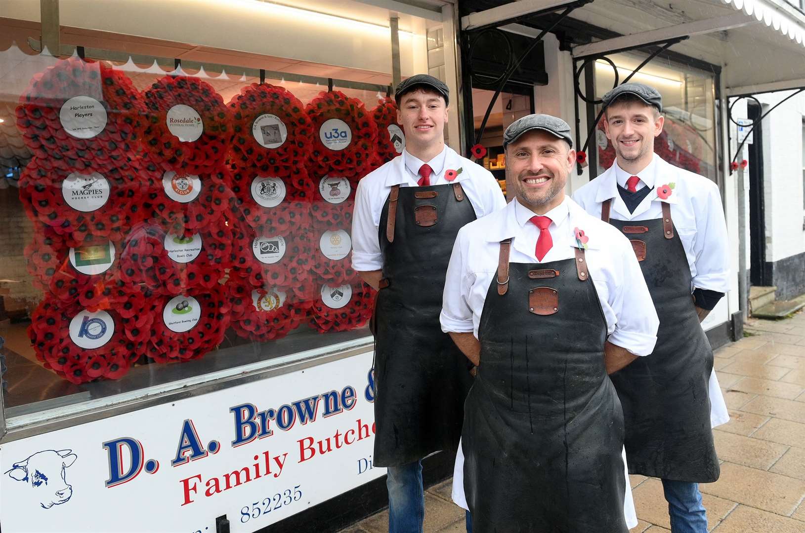 DA Browne & Sons have collected the town's wreaths and have them in a window display in preparation for Remembrance Day.PICTURED: Callum Thompson-Browne, Andy Orford and Oliver French Picture: Mecha Morton