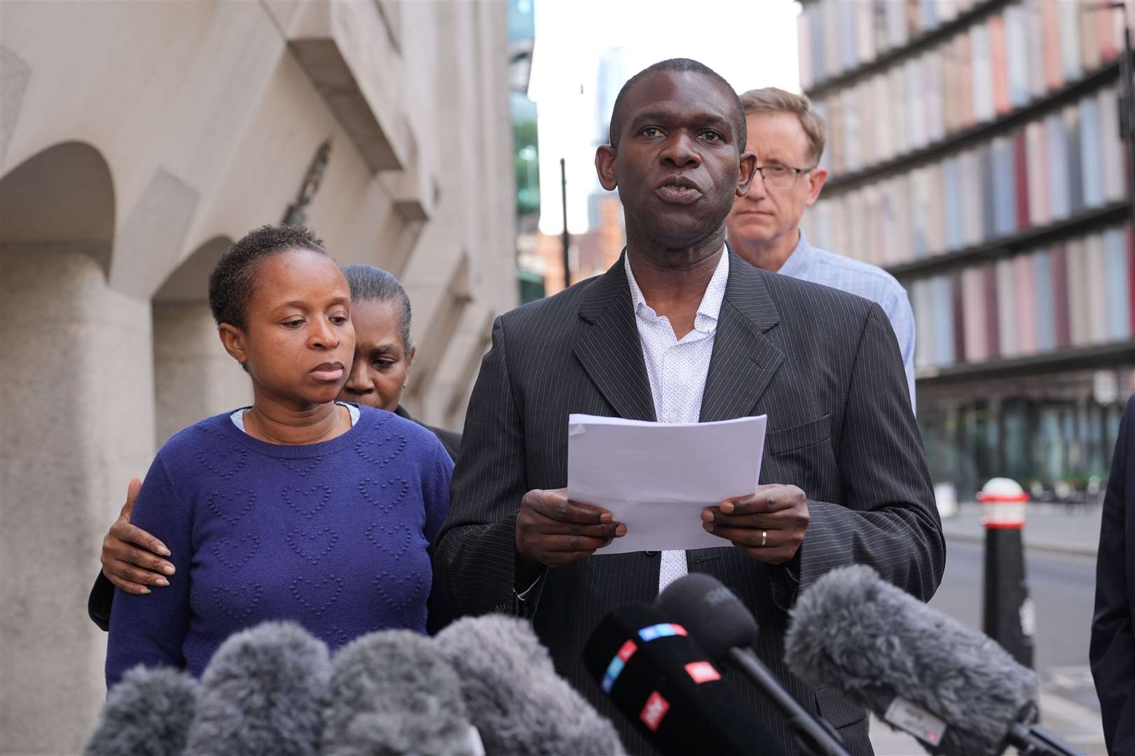 The parents of 14 year-old Daniel Anjorin, Dr Ebenezer Anjorin, and his mother Grace, speaking outside the Old Bailey (Lucy North/PA)